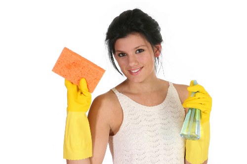 Cleaner working on upper-level glazing at a Stjohnswood apartment building